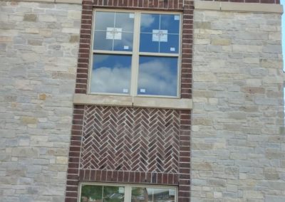 Commercial property with brick and stone veneer by Graff Masonry