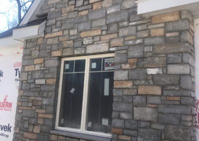 Residential home with stone veneer by Graff Masonry