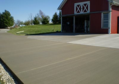 Residential driveway with gray concrete by Graff Masonry